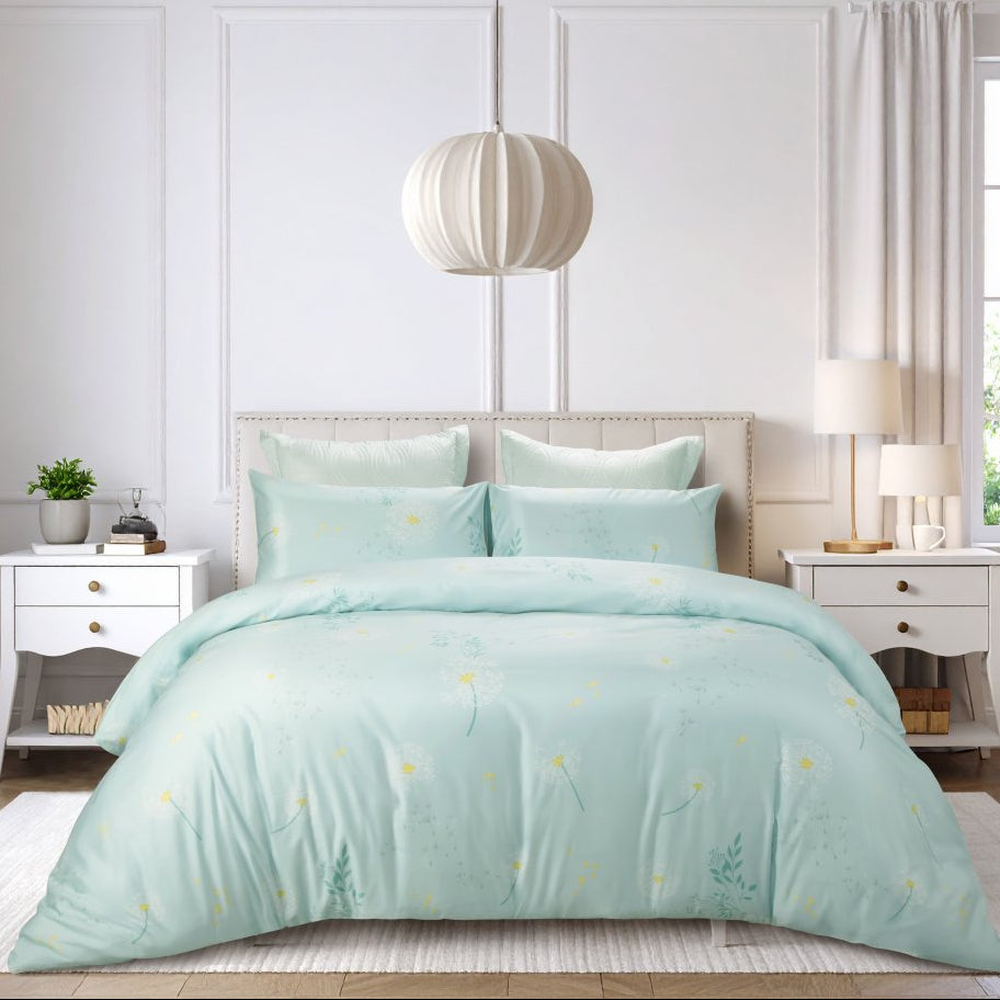 Light blue bed sheet on a bed in a bright bedroom.